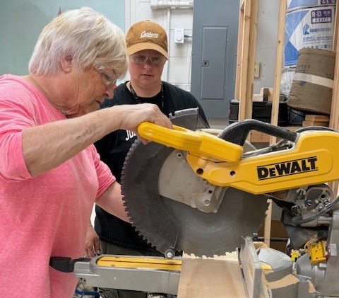 two men and a table saw